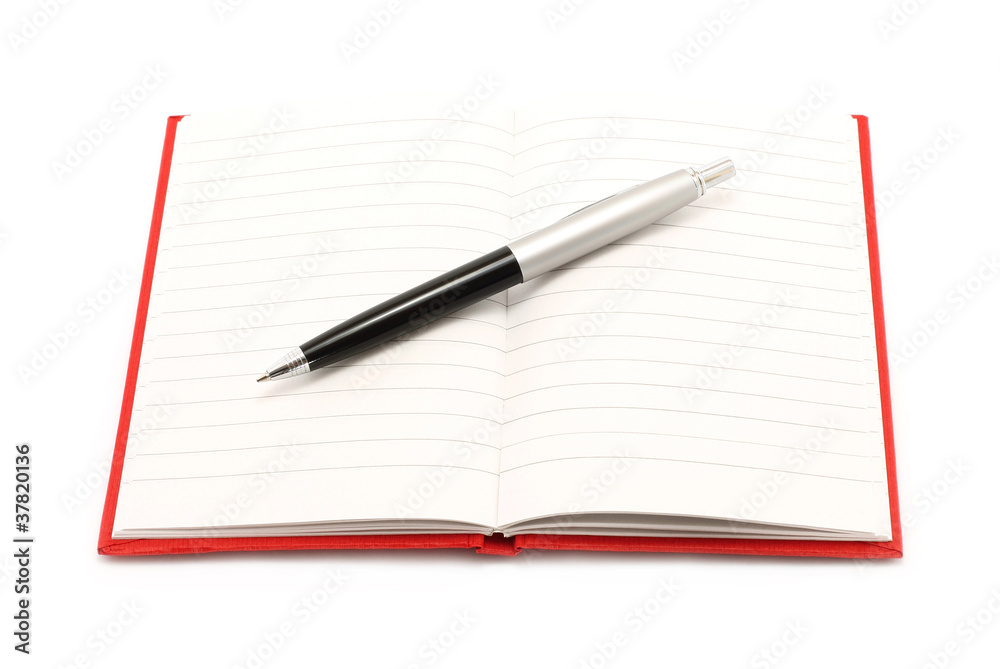 Notepad with ball pen on a white background Notepad with ball pen on a white background