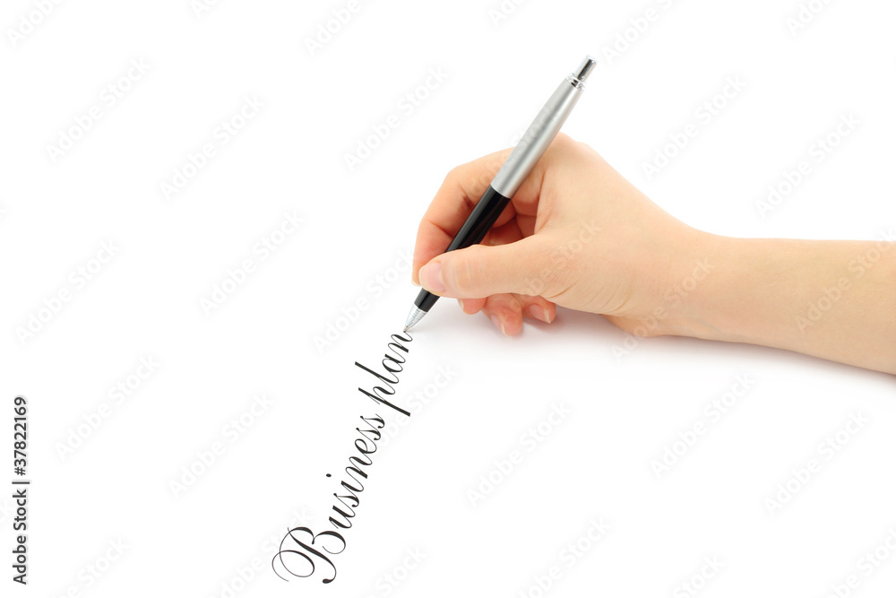 Writing woman hand on a white background Writing woman hand on a white background