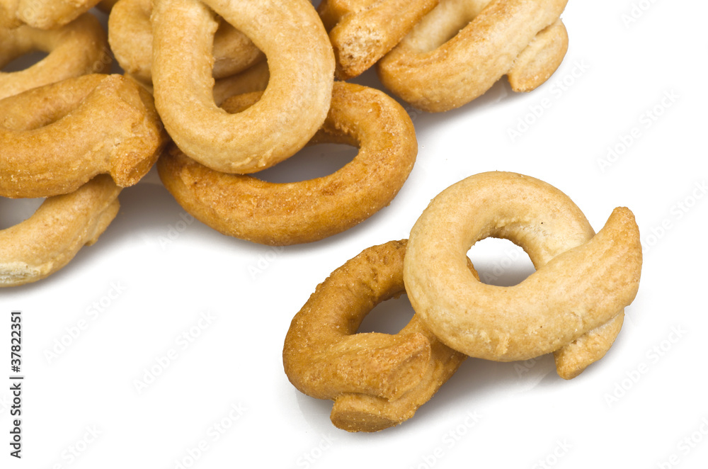 Taralli biscuit with ingredients on the white