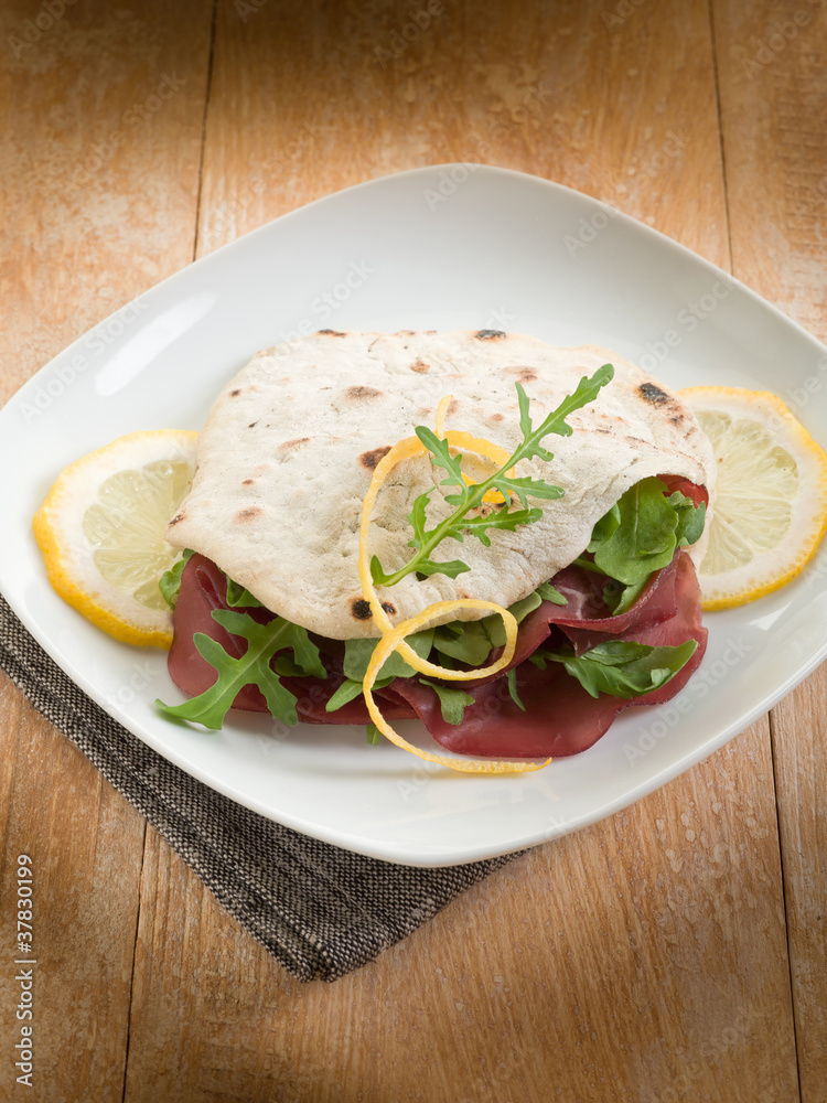 chapati sandwich with bresaola and arugula salad chapati sandwich with bresaola and arugula salad