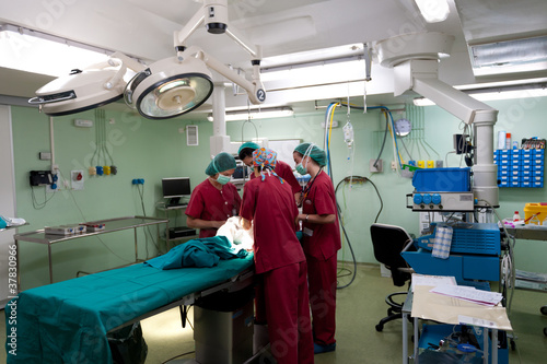 Anesthetic team preparing patient