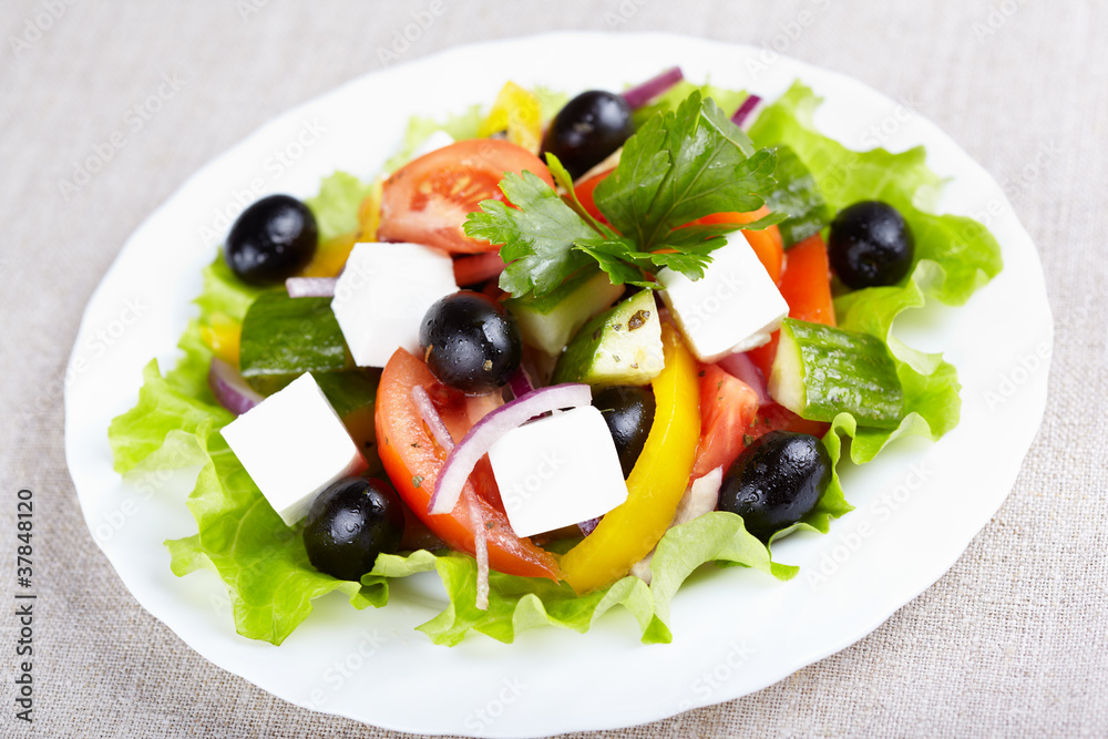 Greek salad on white plate Greek salad on white plate