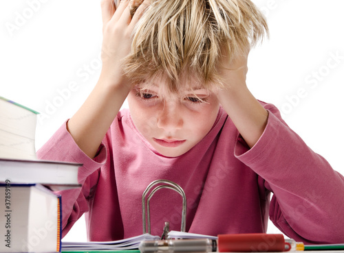 desperate boy doing is homework - isolated on white background