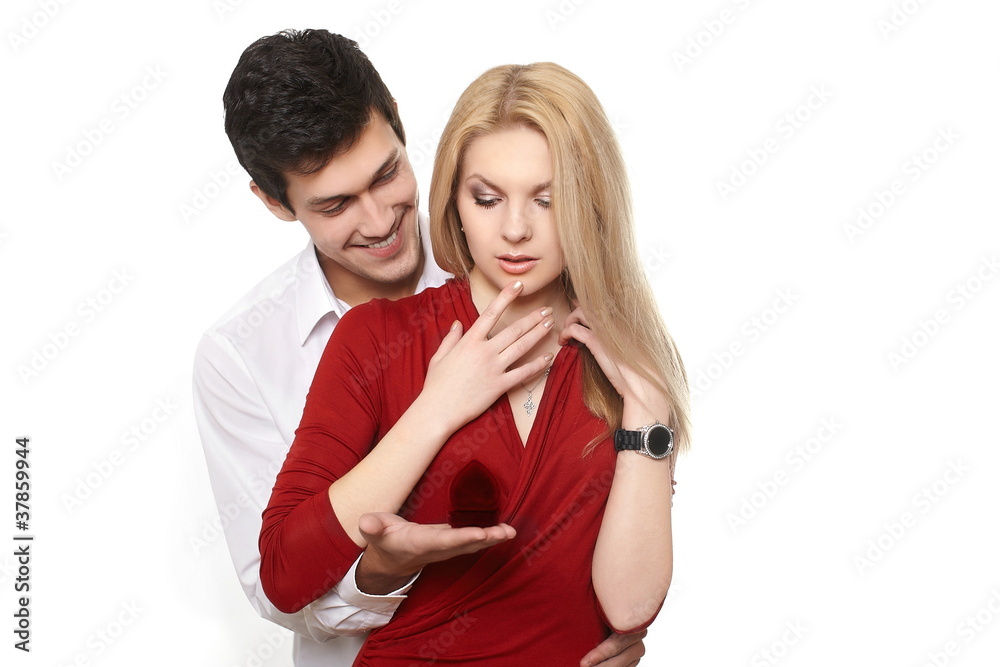 handsome man presenting jewelry in red attractive case handsome man presenting jewelry in red attractive case