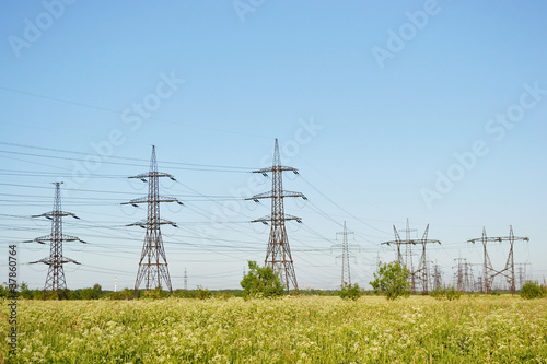 Summer landscape with electricity pylons