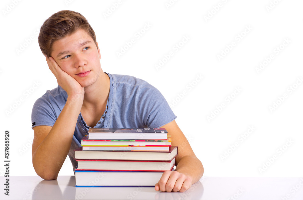 träumender Schüler hinter Bücherstapel träumender Schüler hinter Bücherstapel