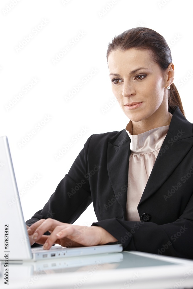 Businesswoman concentrating on work Businesswoman concentrating on work