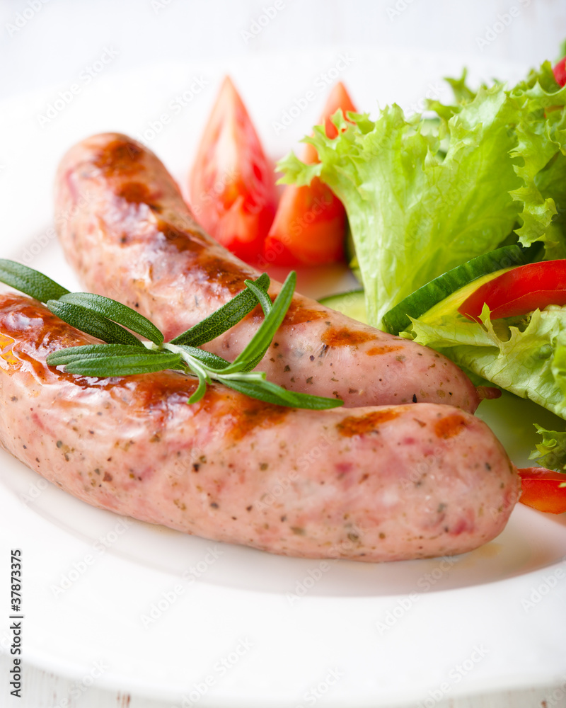 Grilled white sausage (Weisswurst) with vegetables Grilled white sausage (Weisswurst) with vegetables