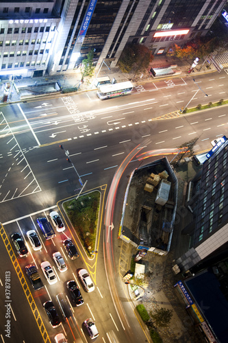 Busy city street at night.