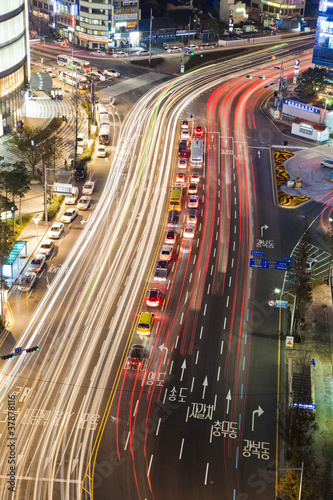 Busy city street at night.