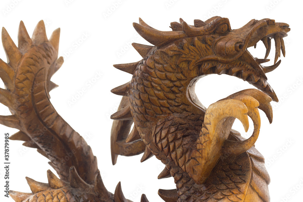Wooden dragon, symbol of chinese new year, isolated on white Wooden dragon, symbol of chinese new year, isolated on white