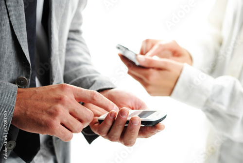 businesspeople text message on their mobile phones