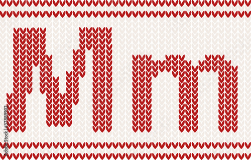Red knitted Letter m on beige Background