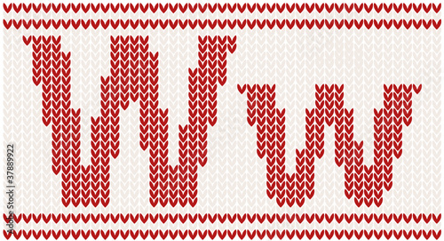 Red knitted Letter W on beige Background