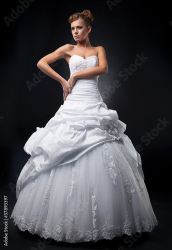 Luxurious fiancee supermodel shows white wedding dress