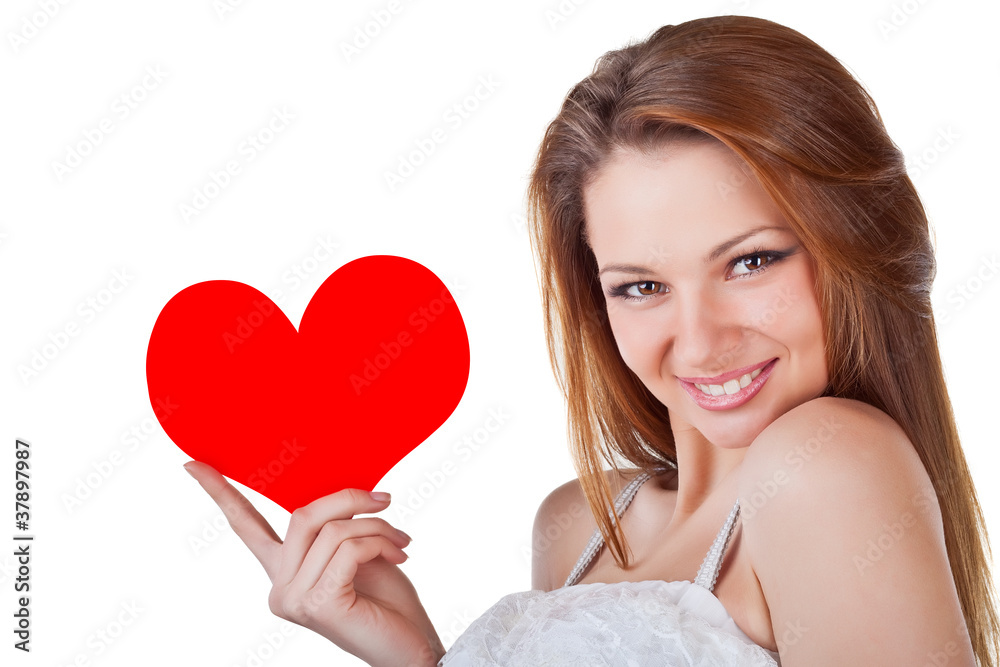 Smiling young woman holding a heart Smiling young woman holding a heart