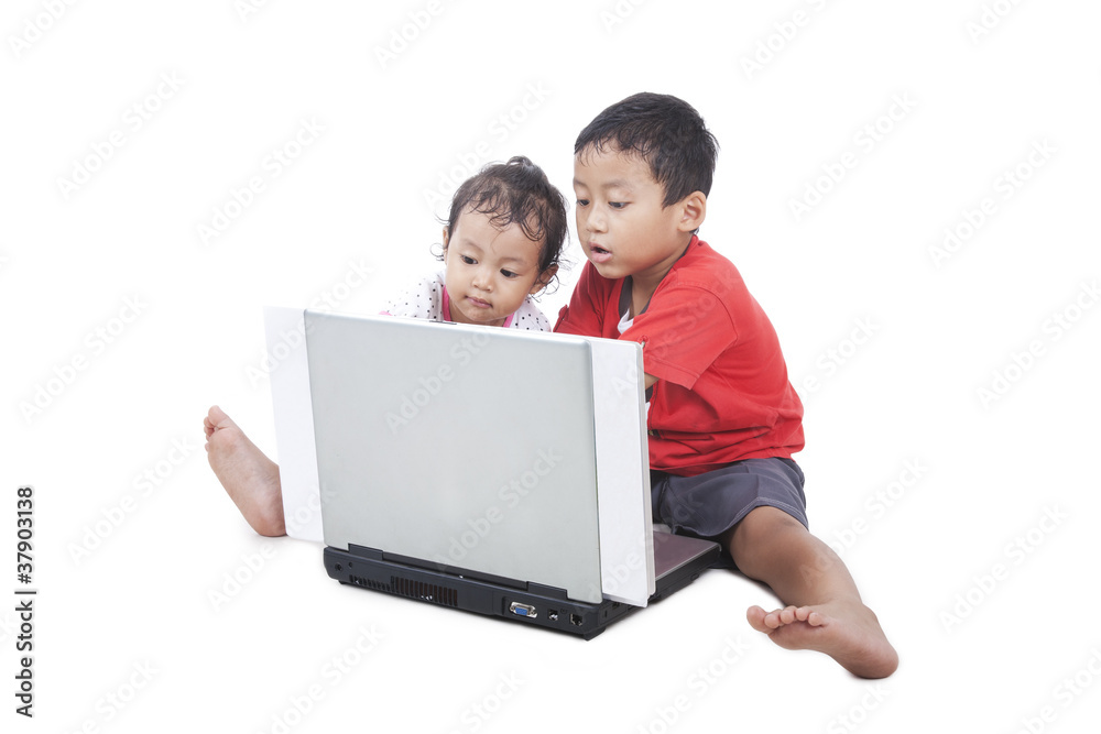 Cute asian kids with computer