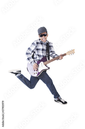 Man jumping with electric guitar