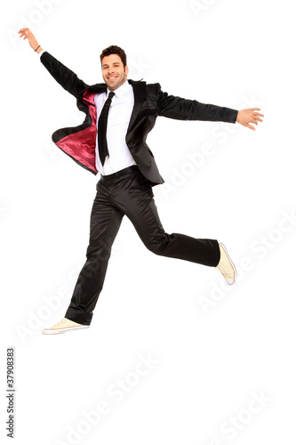 handsome jumping man on suit