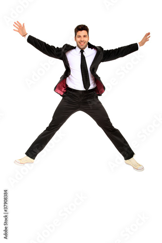 handsome jumping man on suit