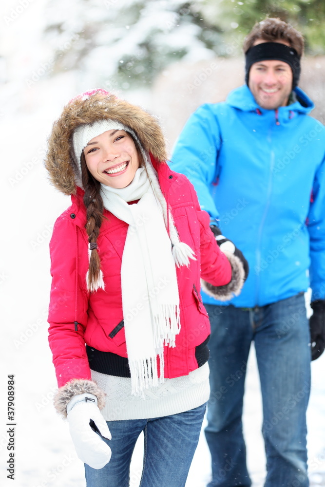 Happy winter couple in snow