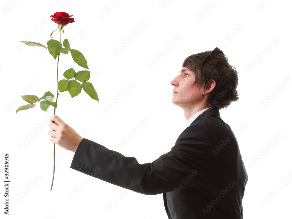 Young man presenting a flower - red rose isolated Young man presenting a flower - red rose isolated