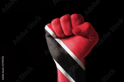 Fist painted in colors of trinidad tobago flag