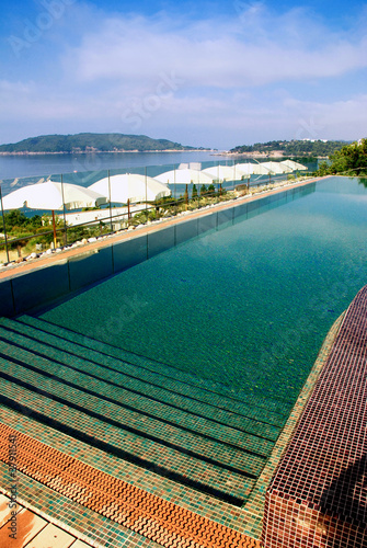 Vertical image of swimming pool and sea view