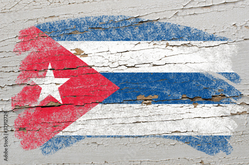 flag of cuba on grunge wooden texture painted with chalk