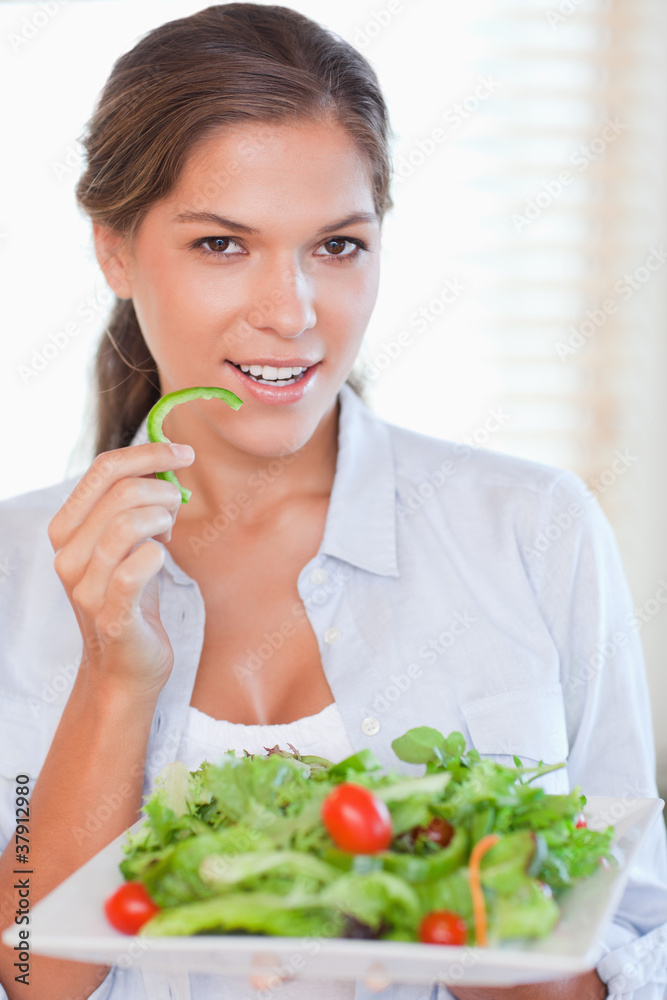 Portrait of a woman eating a salad Portrait of a woman eating a salad