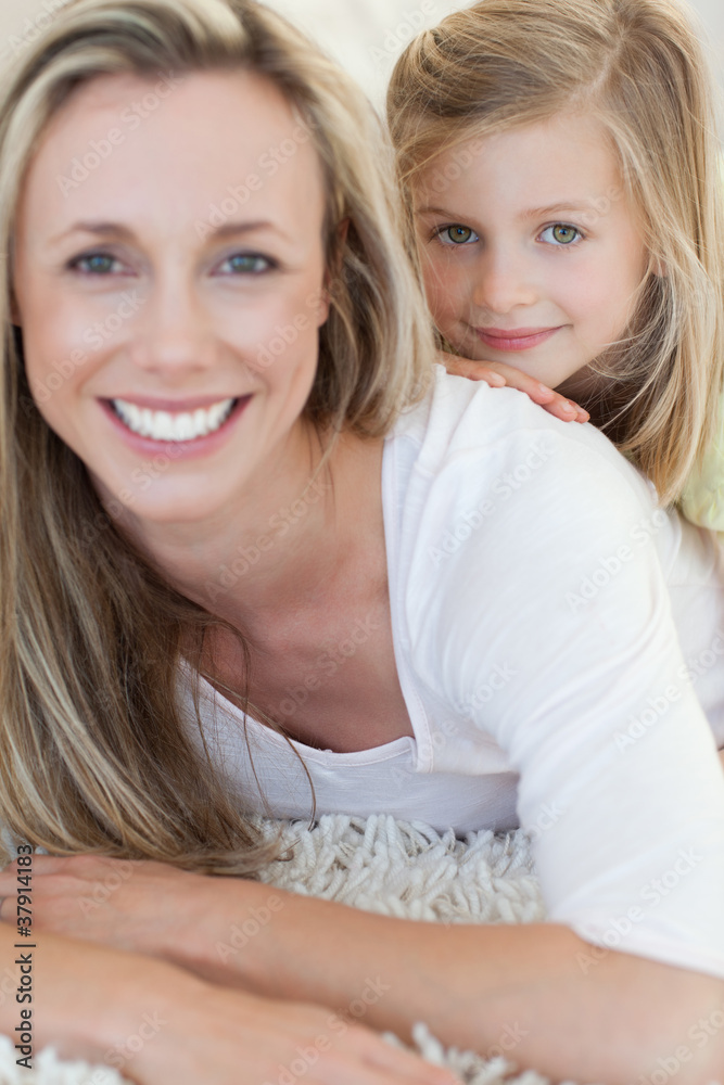Happy mother and daughter on the floor Happy mother and daughter on the floor