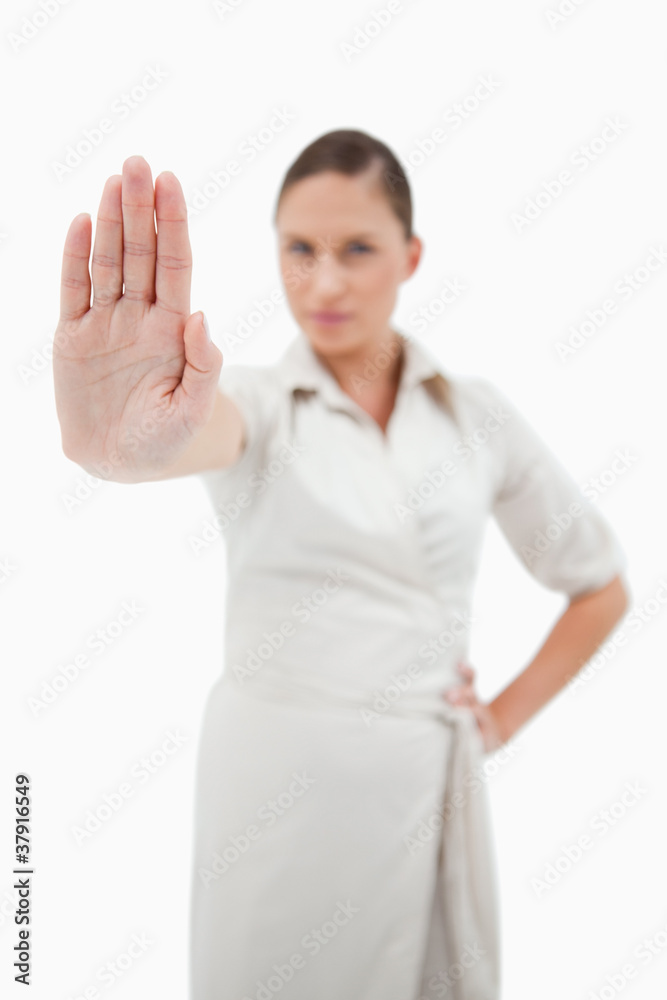Portrait of a fit businesswoman making a stop sign