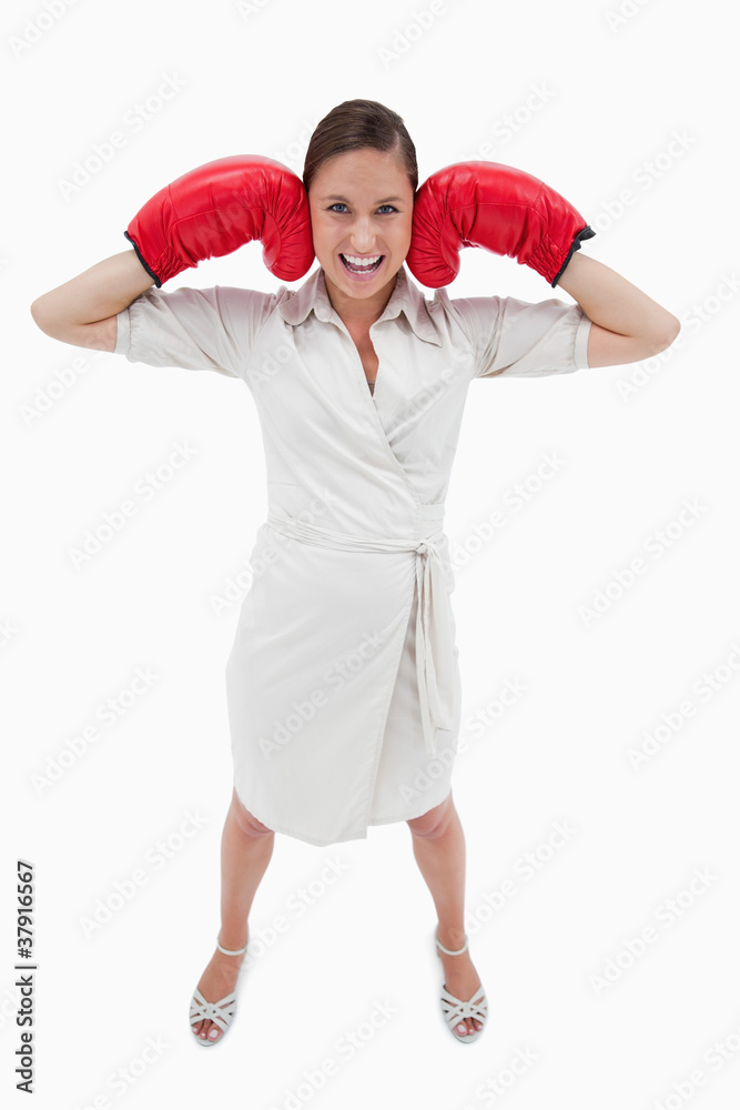 Portrait of a businesswoman with boxing gloves Portrait of a businesswoman with boxing gloves