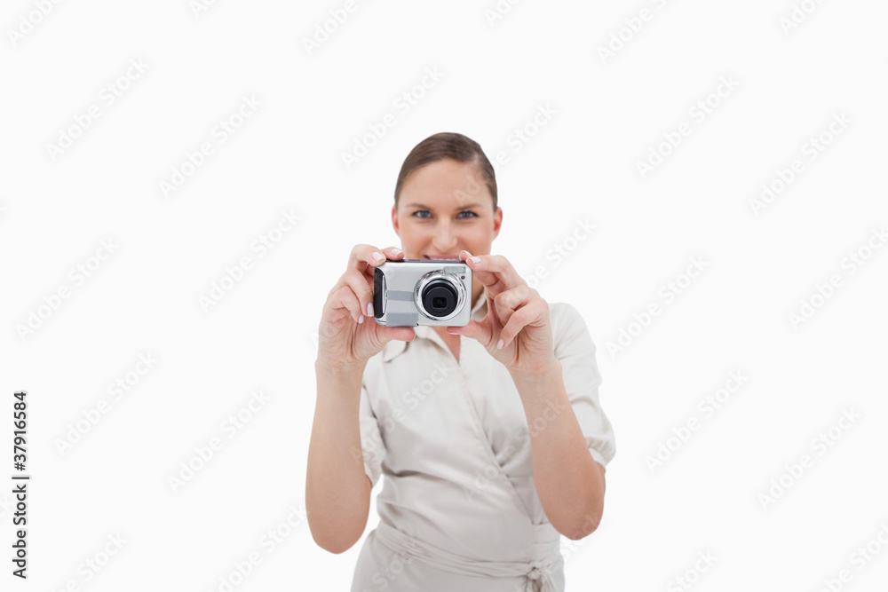 Smiling businesswoman taking a picture Smiling businesswoman taking a picture