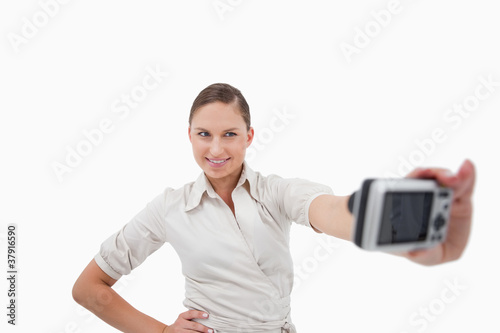 Young businesswoman taking a picture of herself