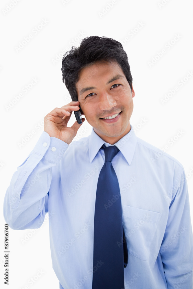 Portrait of a smiling businessman making a phone call Portrait of a smiling businessman making a phone call