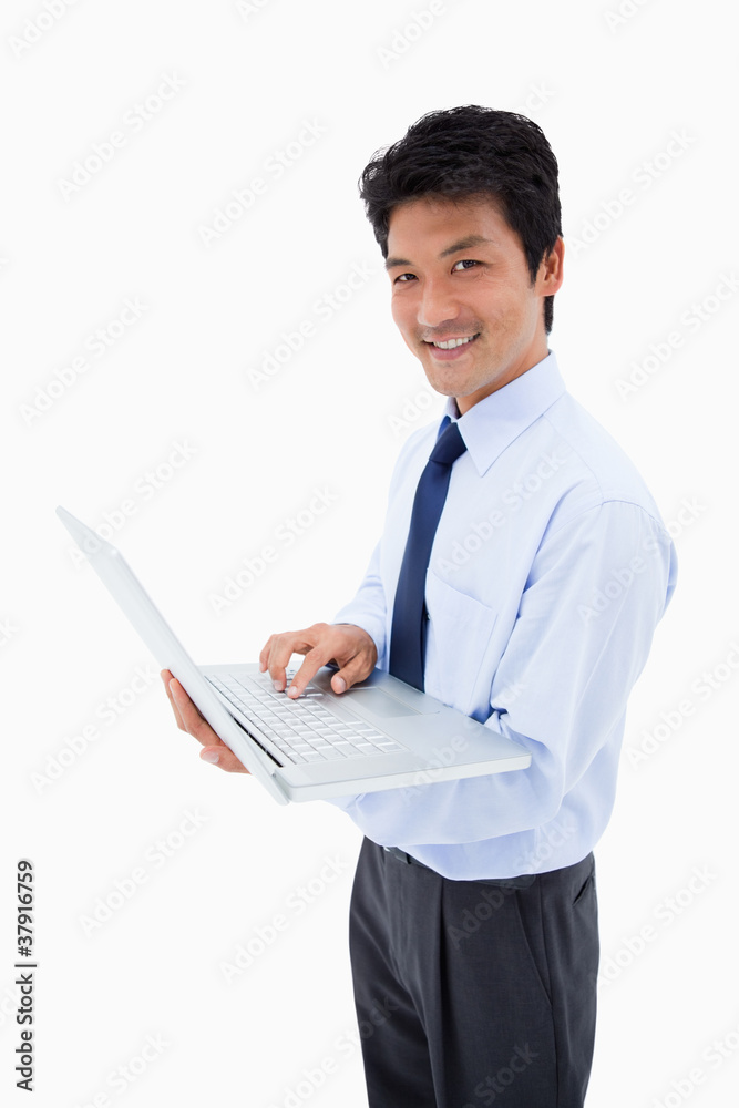 Portrait of a smiling businessman using a laptop Portrait of a smiling businessman using a laptop