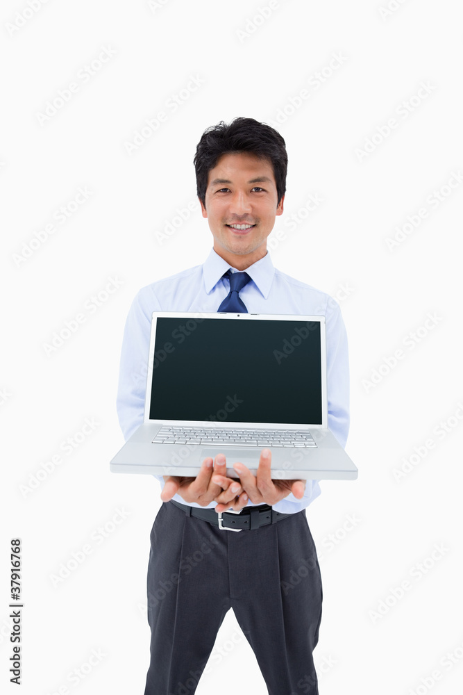 Portrait of a businessman showing a notebook Portrait of a businessman showing a notebook