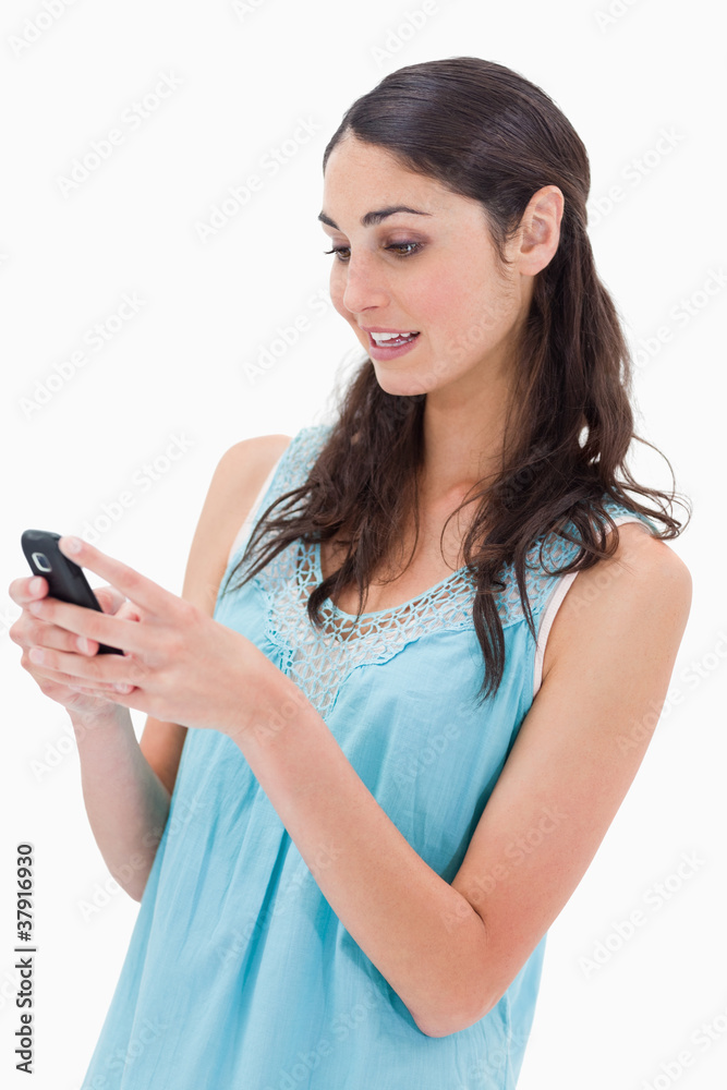 Portrait of a woman reading a text message Portrait of a woman reading a text message