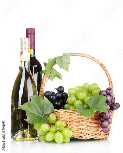Ripe red grapes and wine in basket isolated on white