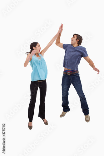 Portrait of a couple jumping together