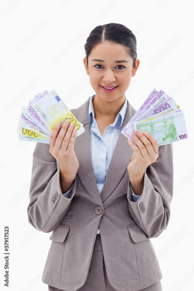 Portrait of a happy businesswoman holding bank notes Portrait of a happy businesswoman holding bank notes