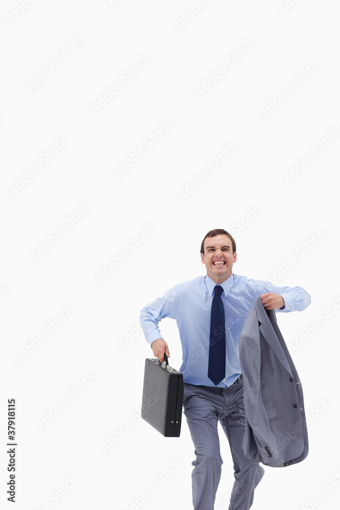 Happy businessman with suitcase about to jump