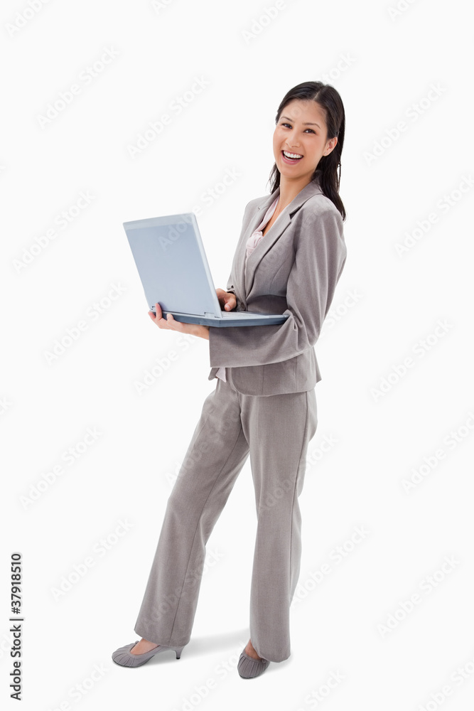 Side view of laughing businesswoman with notebook Side view of laughing businesswoman with notebook