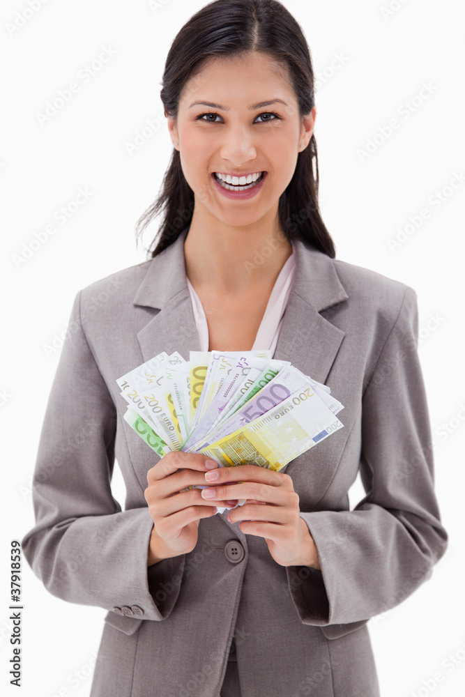 Smiling businesswoman with bank notes in her hands Smiling businesswoman with bank notes in her hands