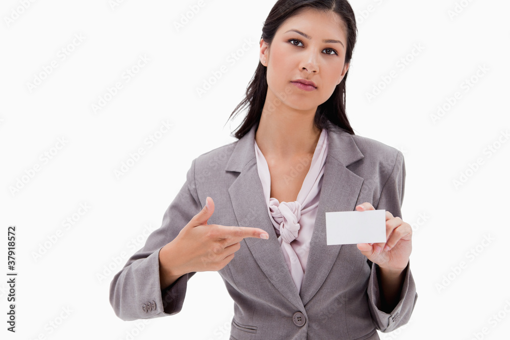 Businesswoman pointing at name badge Businesswoman pointing at name badge