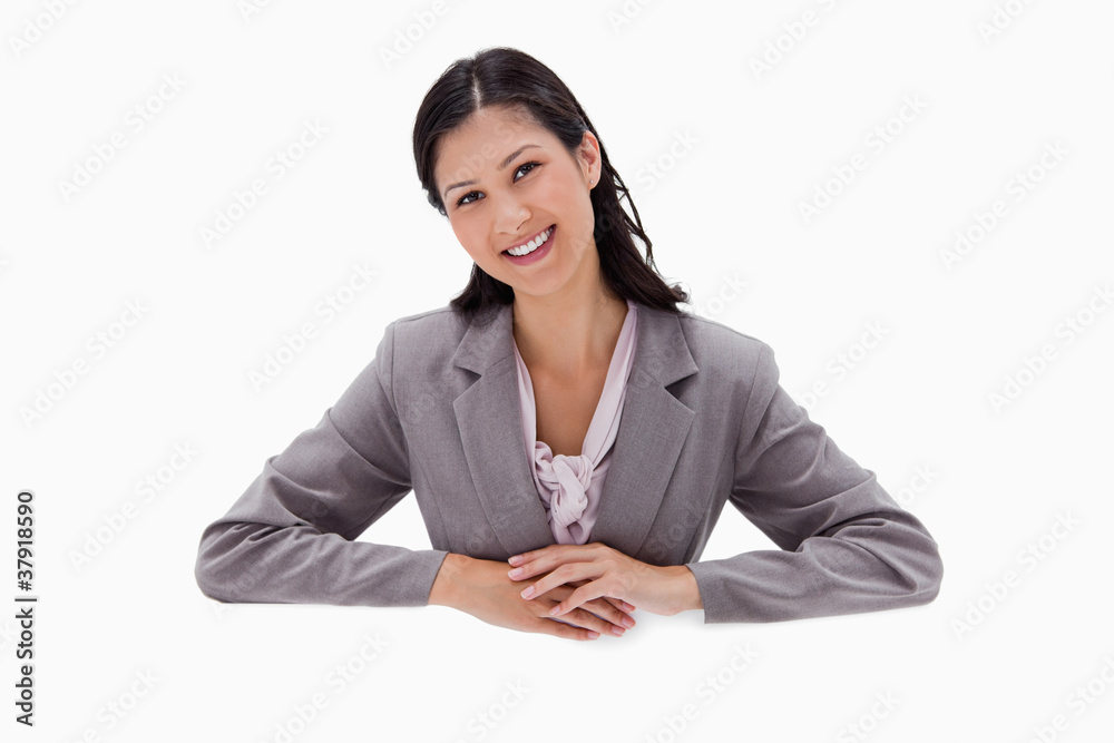 Businesswoman leaning on blank wall Businesswoman leaning on blank wall