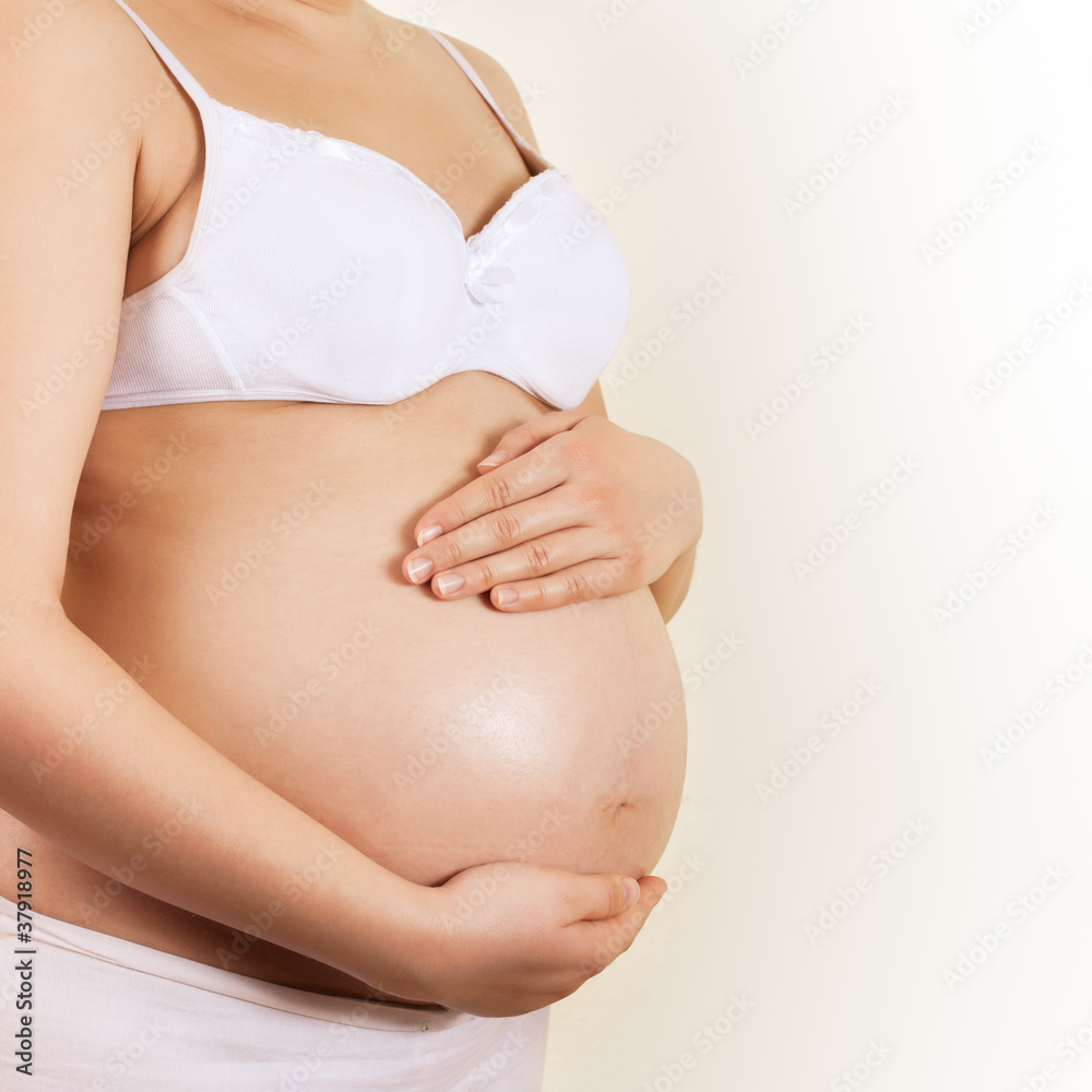 Pregnant woman take care about her belly