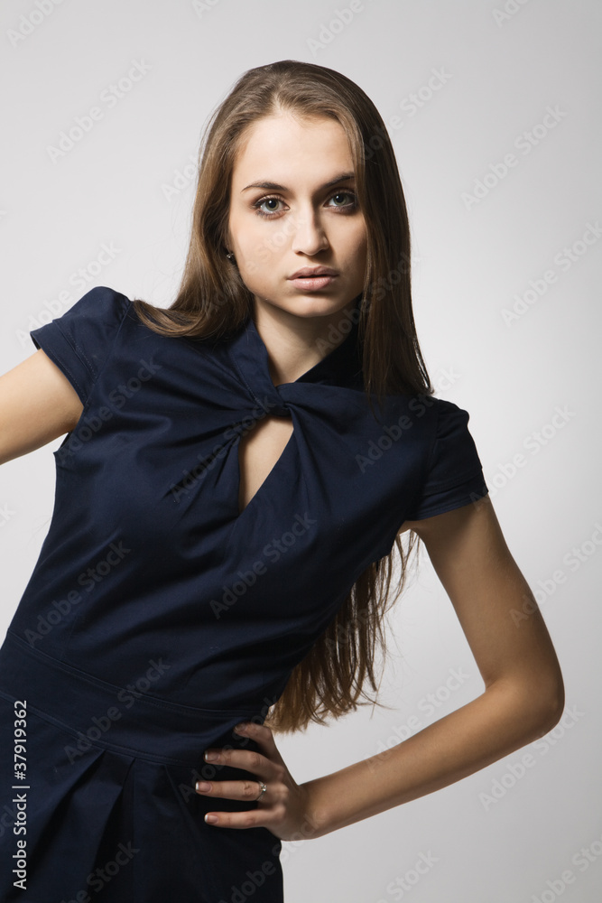 Beautiful fashion model in strict blue dress Beautiful fashion model in strict blue dress