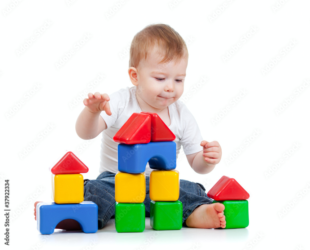 little boy playing with building blocks little boy playing with building blocks